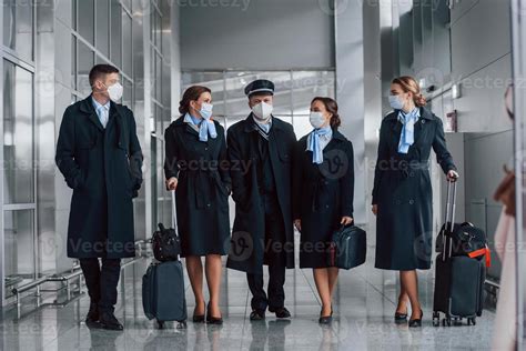 Aircraft crew in work uniform is together outdoors in the airport 15458227 Stock Photo at Vecteezy