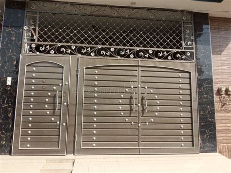 Steel House Front Gate Grill Design Images : Golden door handle, white and gold door.