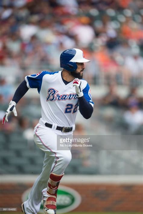 Nick Markakis of the Atlanta Braves runs to first base against the ...