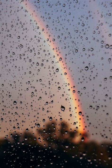 Download Aesthetic Rainbow Behind Wet Window Wallpaper | Wallpapers.com