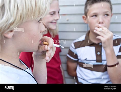 Children smoking cigarettes, close-up Stock Photo: 27409923 - Alamy