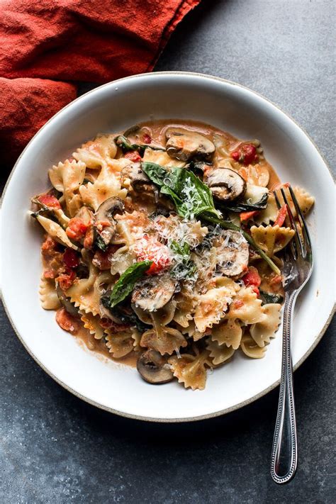 Farfalle Pasta with Mushrooms and Spinach in a Creamy Tomato Sauce — Flourishing Foodie ...