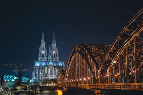 Illuminated Cologne Cathedral and Hohenzollern Bridge at Night · Free ...