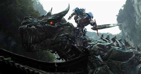 Optimus Prime riding a giant Dinosaur | Image