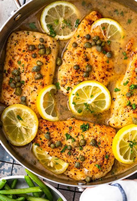 Easy Chicken Piccata with lemon white wine sauce with lemons and capers in skillet | Chicken ...