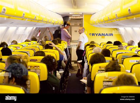 Passengers in a queue for the toilet during a flight, Ryanair plane ...