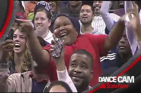 Epic dance battle between an usher and a young fan.