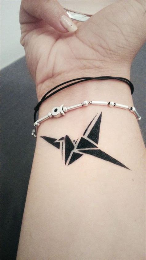 Origami crane tattoo | Origami tattoo, Bird tattoo wrist, Paper crane ...