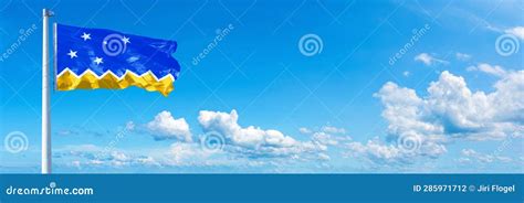 Magallanes Region Flag, Flag Waving on a Blue Sky in Beautiful Clouds - Horizontal Banner Stock ...
