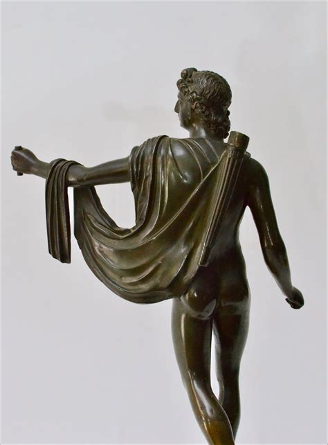 A Patinated Bronze Sculpture Of Apollo With An Ormolu Mounted Marble Base.