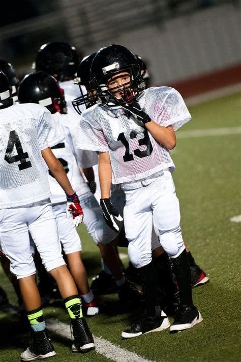 Young Football Boy with His Team Stock Photo - Image of scrimmage, sport: 33072030