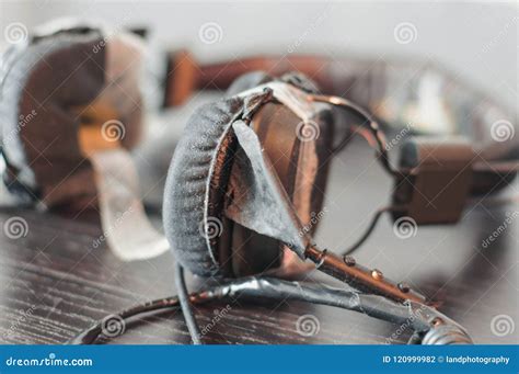 Broken Headphones on the Wooden Table Stock Photo - Image of crack, close: 120999982