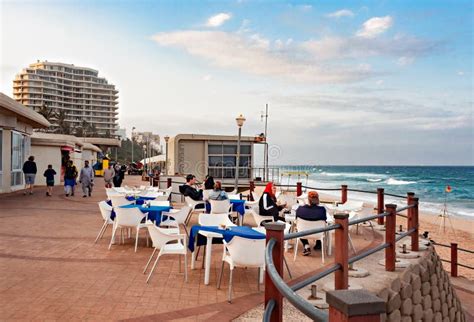 Tourists Enjoying Lunch at a Restaurant on the Promenade at the Beach ...