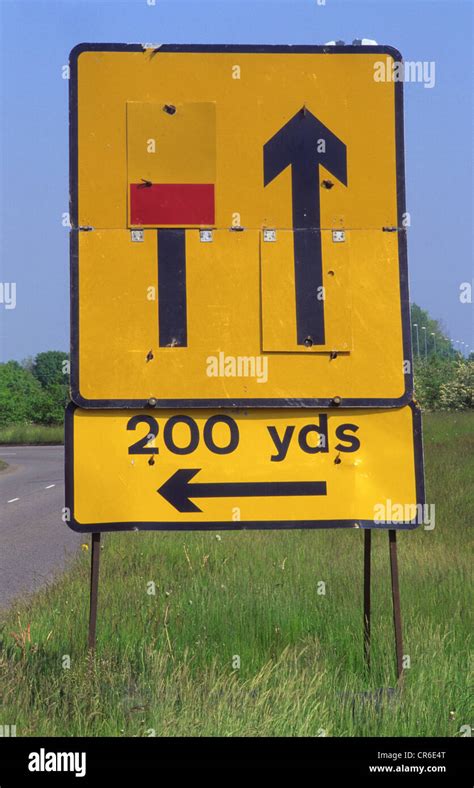 warning sign of closed left hand lane ahead on dual carriageway uk Stock Photo - Alamy