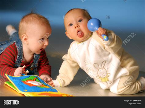 Babies Playing Toys Image & Photo | Bigstock