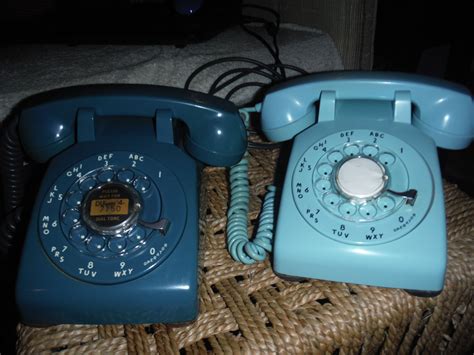 A 1956 Western Electric 500 in mediterranean blue and a 1958 Western Electric 500 in light blue ...