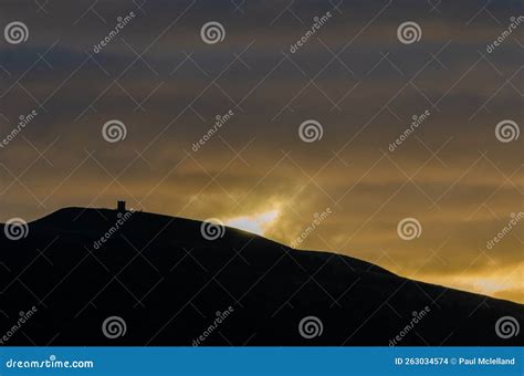 Rivington Pike Silhouette at Sunrise with Sun Lighting Clouds Stock ...