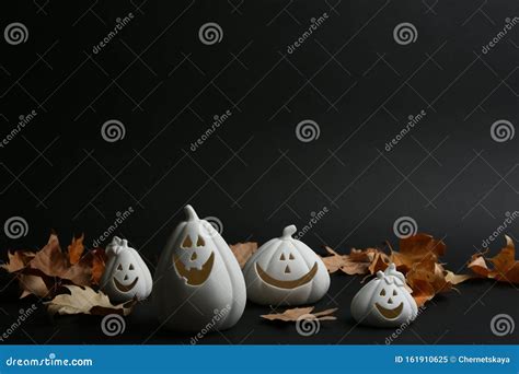 Jack-o-Lantern Candle Holders and Fallen Leaves on Black. Halloween ...