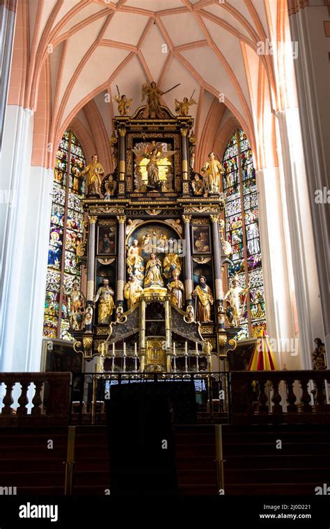 View of the interior of the Basilica St. Michael. A beautiful ornated altar, the walls are ...