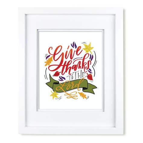 a white framed print with the words give thanks and stars