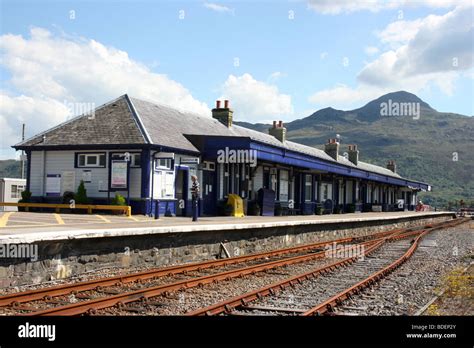 the train station at Kyle of Lochalsh, Western Scotland, with the mountains of the Isle of Skye ...