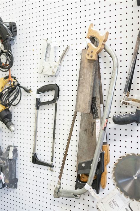 Tools hanging on a pegboard in a garage photo – Free Tools Image on ...