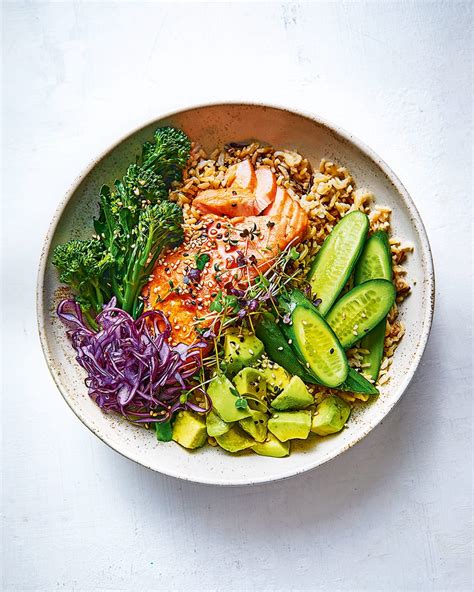 Salmon and avocado rice bowl with soy and lemon dressing