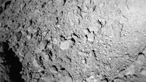 Japan's asteroid probe sends lander to surface, delivers another 'first' photo