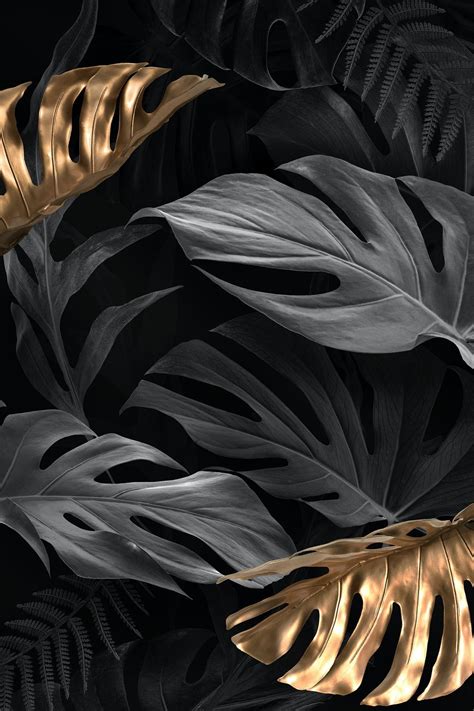 black and gold leaves on a black background