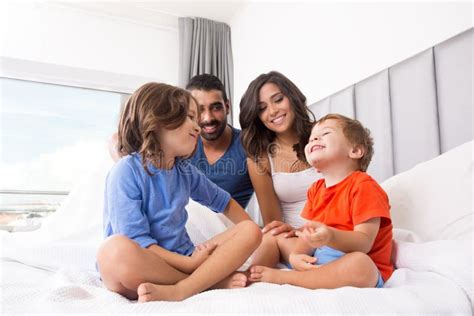 Family in bed stock photo. Image of father, looking, hispanic - 45343028