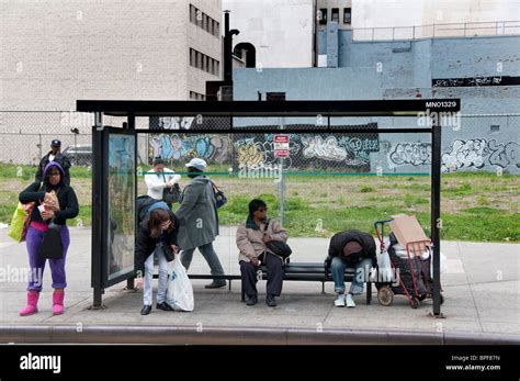 Bus stop with people waiting in West Harlem New York City Stock Photo ...