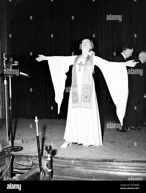 Sister Aimee Semple McPherson leads the singing during her regular ...