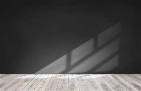 Free Photo | Black wall in an empty room with wooden floor