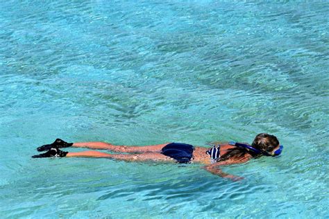 Woman Snorkeling in Lagoon at Half Moon Cay, The Bahamas - Encircle Photos