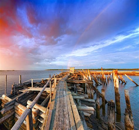 Old wooden pier at sunset. stock image. Image of outdoor - 33603803