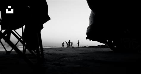 A group of people walking on a beach photo – Free Surfside beach Image ...