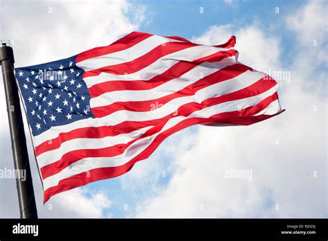 American Flag waving in the wind Stock Photo - Alamy