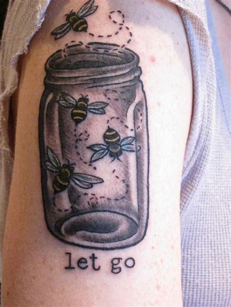 a woman with a tattoo on her arm has a jar filled with bees and the ...