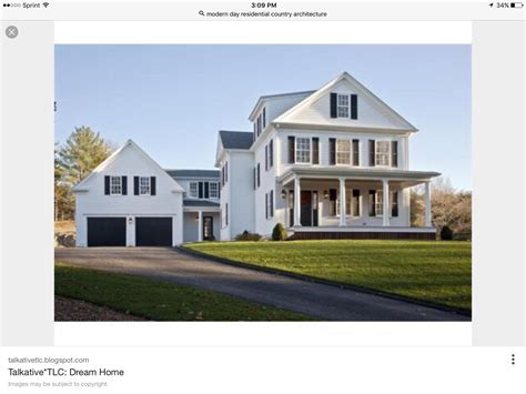 White Colonial House With Black Garage Doors - ZTech