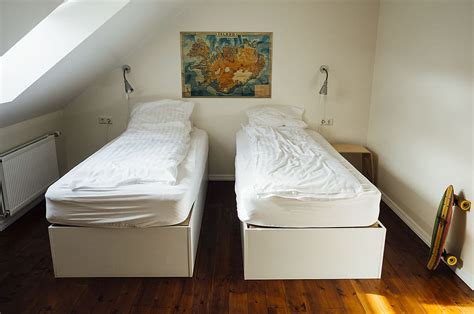 room, beds, covers, sheets, pillows, hardwood, floors, skateboard ...