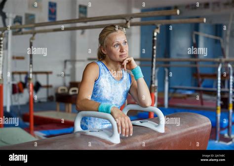 Woman posing near gymnastic equipment Stock Photo - Alamy