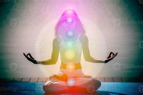 Young aura woman in yoga meditation with nature seven chakras and Yin Yang symbols. 14938232 ...