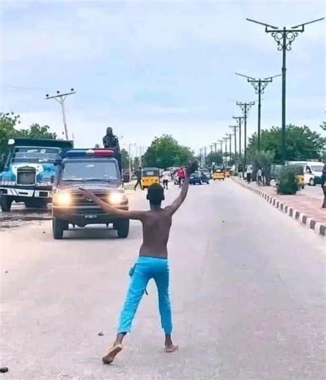 Protester Displays Nigerian Police Badge (photo) - Politics - Nigeria