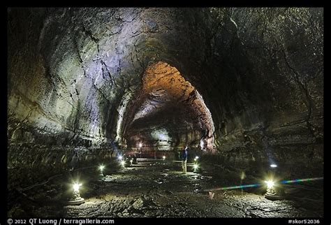 Picture/Photo: Manjanggul Lava cave with visitor standing. Jeju Island, South Korea