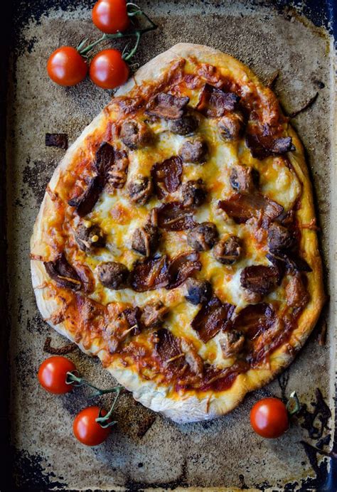 This homemade pizza dough by hand is the perfect recipe for crispy on the outside and chewy on ...