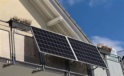 solar panels on the side of a building with blue skies in the backround