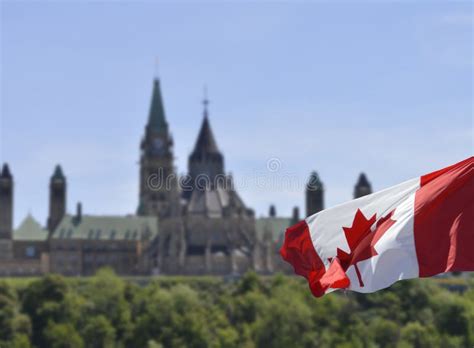 Canadian Parliament Hill with the Background Blurred. Focus on the Flag Stock Image - Image of ...