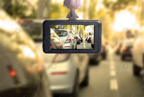 Modern dashboard camera mounted in car, view of road during driving ...