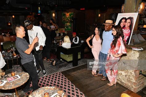 Cher Hubsher and Dawn Hubsher pose with a guest at the book launch... News Photo - Getty Images