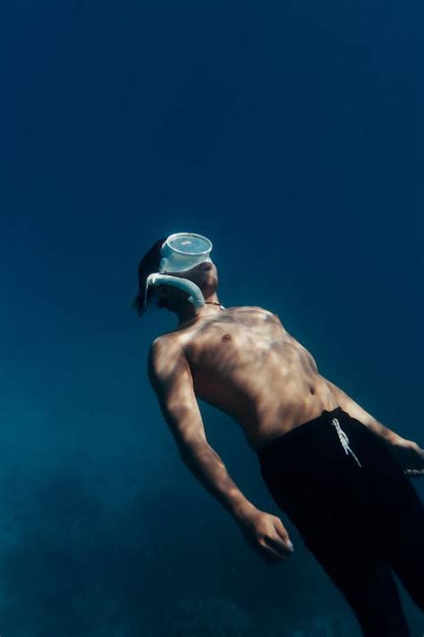 Man Swimming Underwater · Free Stock Photo